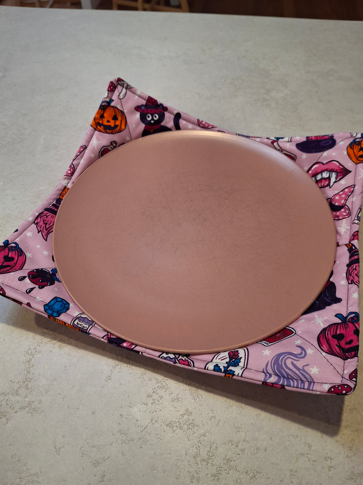 Pink Halloween plate cosy