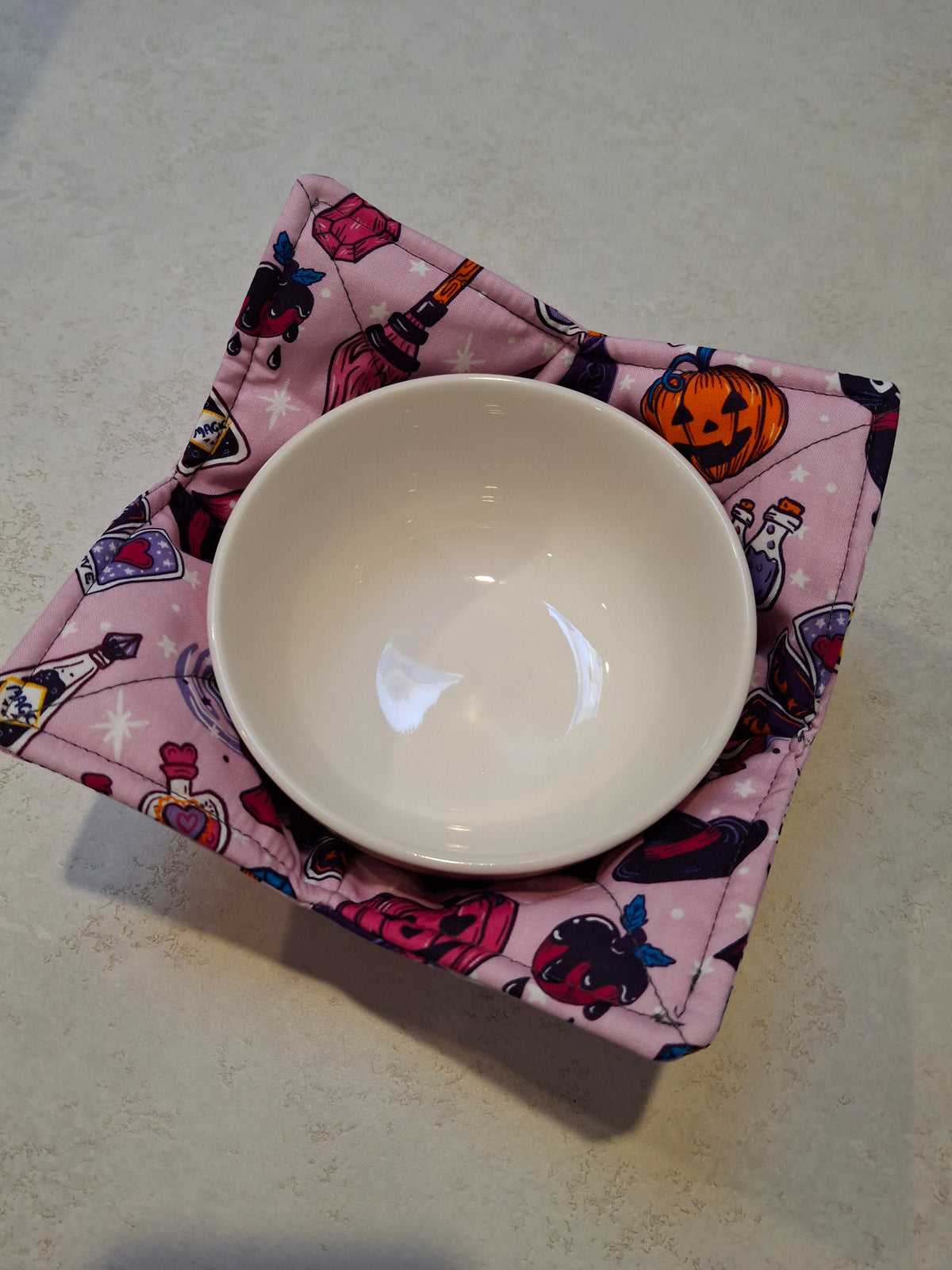 Pink Halloween bowl cosy