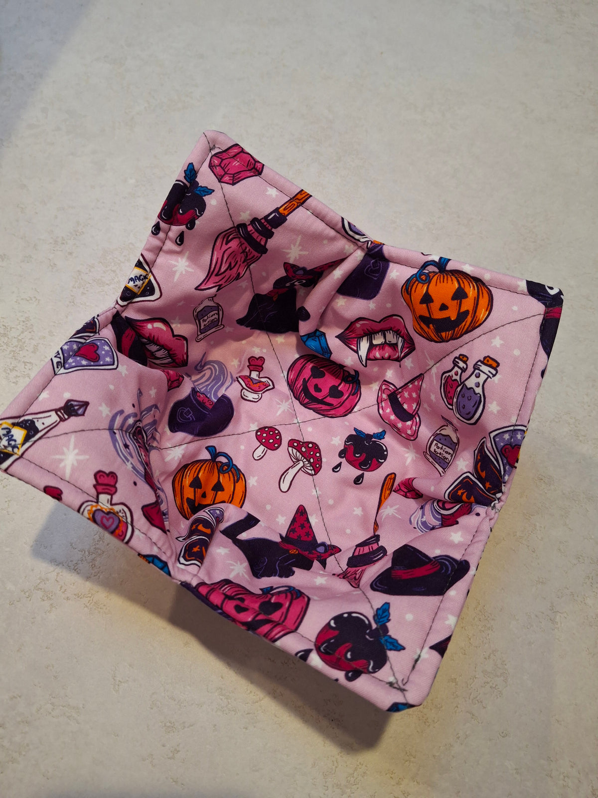 Pink Halloween bowl cosy