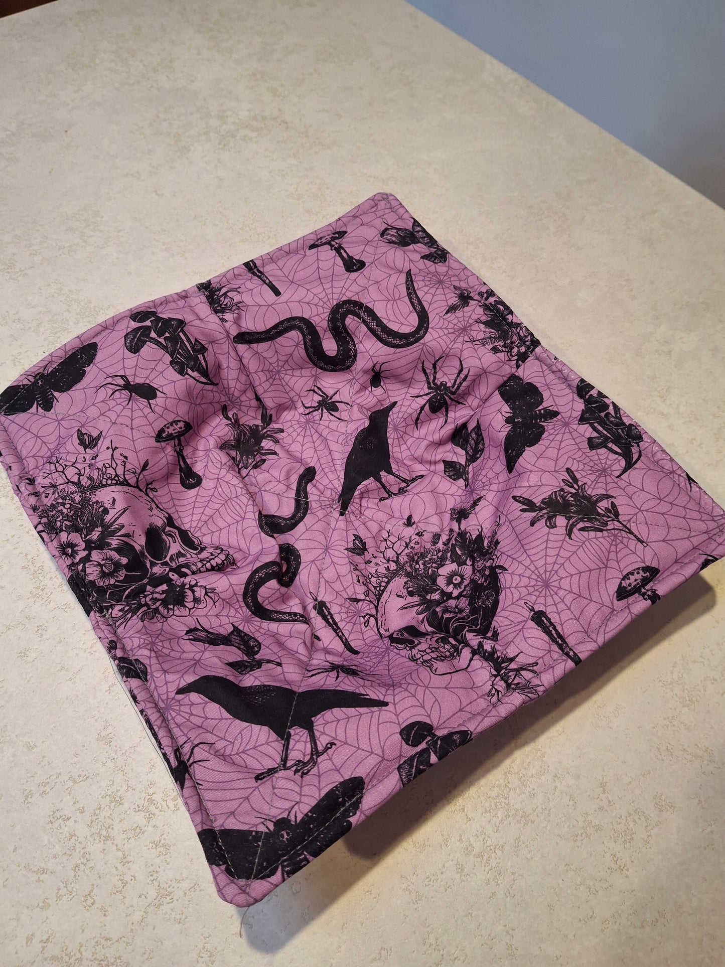 Purple spooky plate cosy